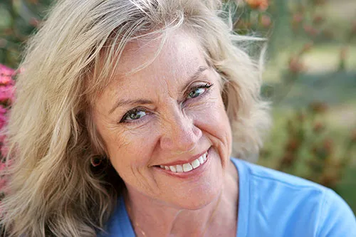 Smiling woman with dental implants
